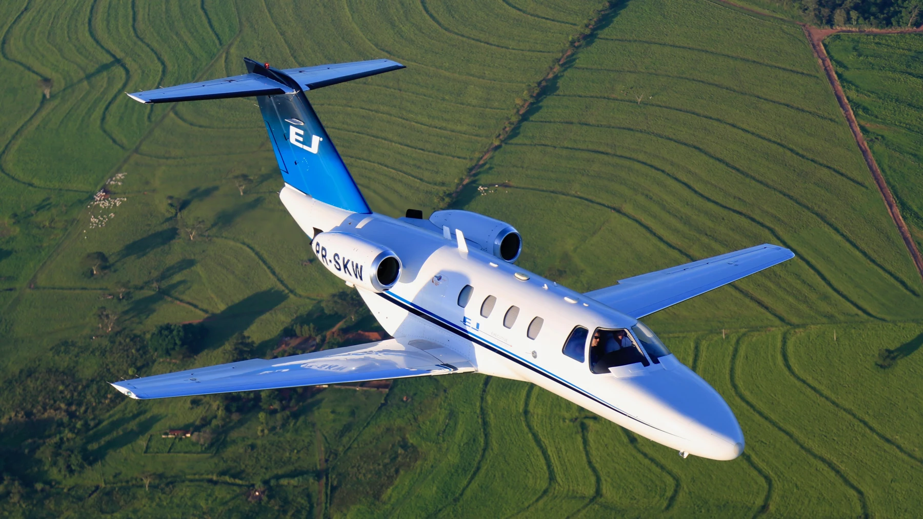 Cessna Citation 525 in flight with landing gear fully retracted